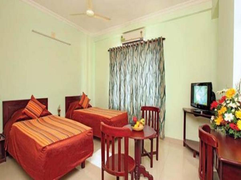 Sm Regency Kochi Quarto foto