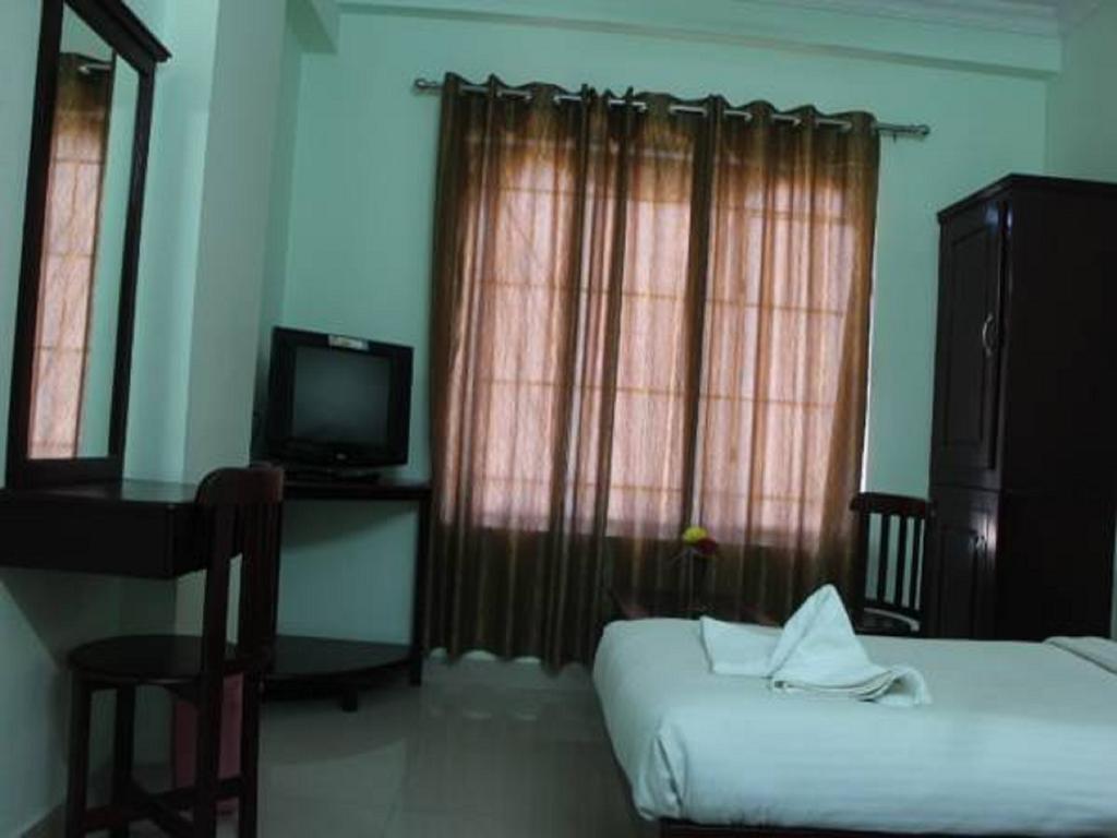 Sm Regency Kochi Quarto foto